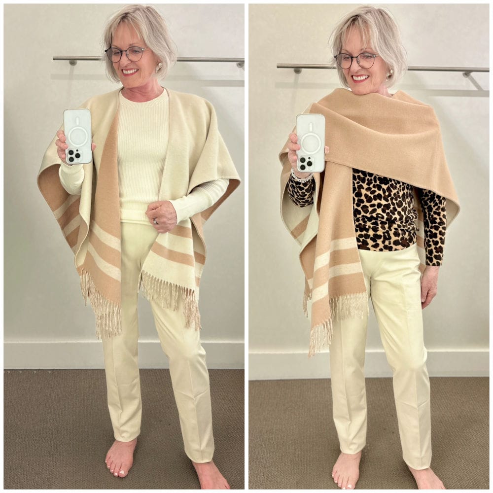 woman showing reversible ruana in ivory and camel over cream ppants and leopard print sweater