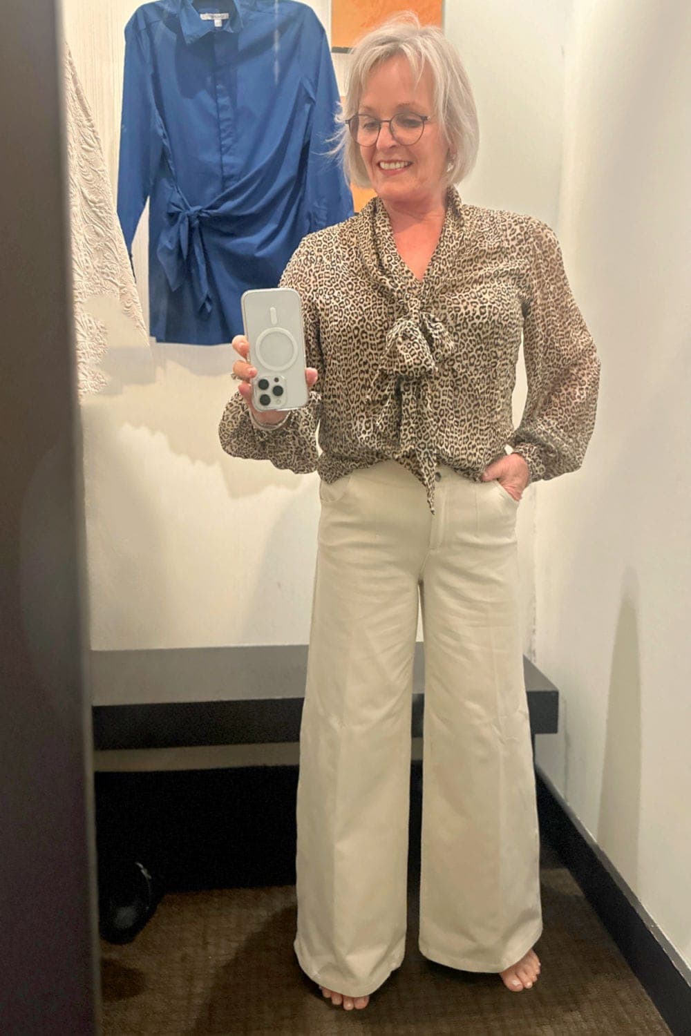 woman wearing leopard priont blouse from chico’s