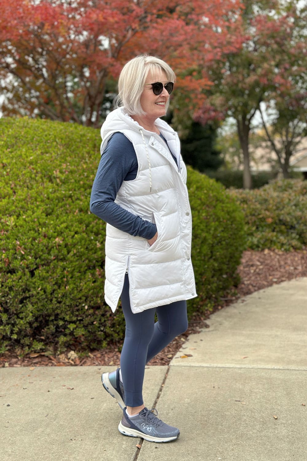 Zella long white hooded puffer vest over vuori leggings and tee for a casual walk