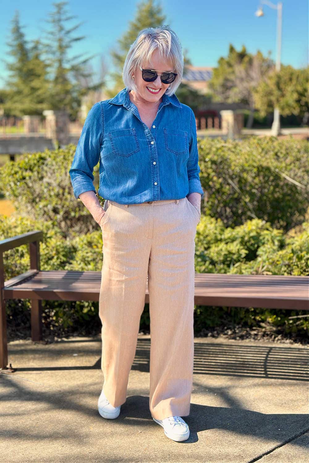 woman styling denim shirt with linen pants