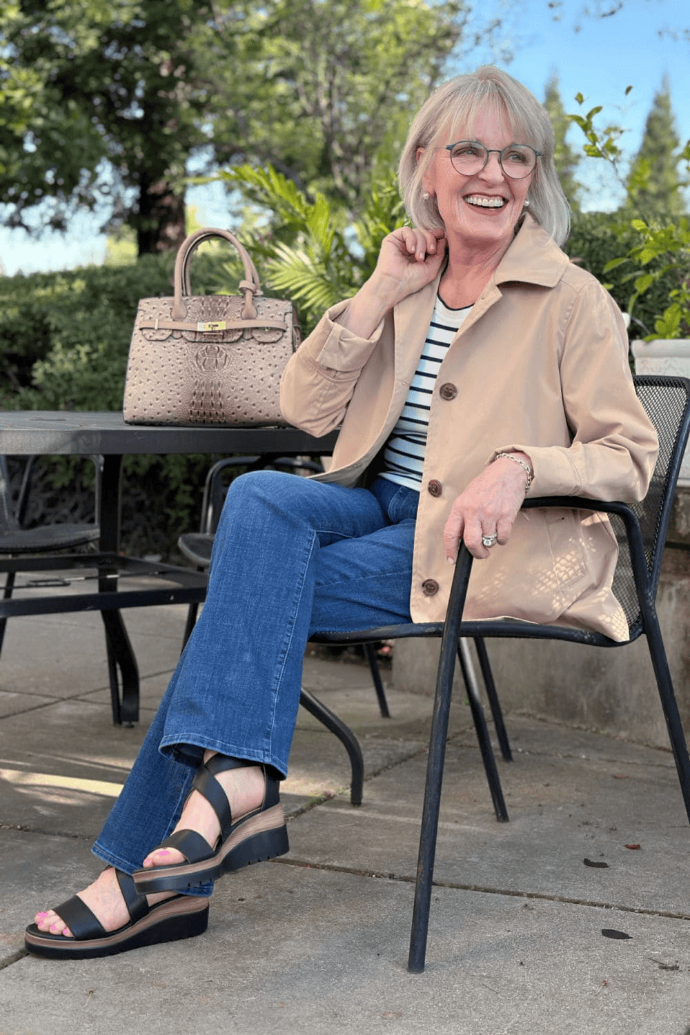 Stylish and supportive wedge sandals with classic jeans for women over 60 to look chic