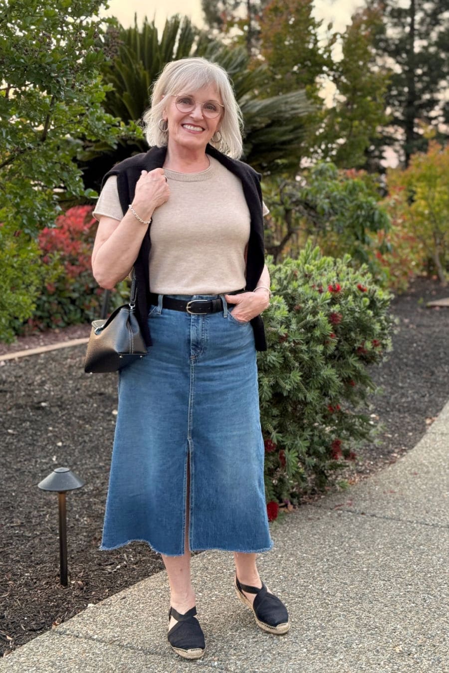 Spring outfit with denim skirt and black espadrilles for women over 60