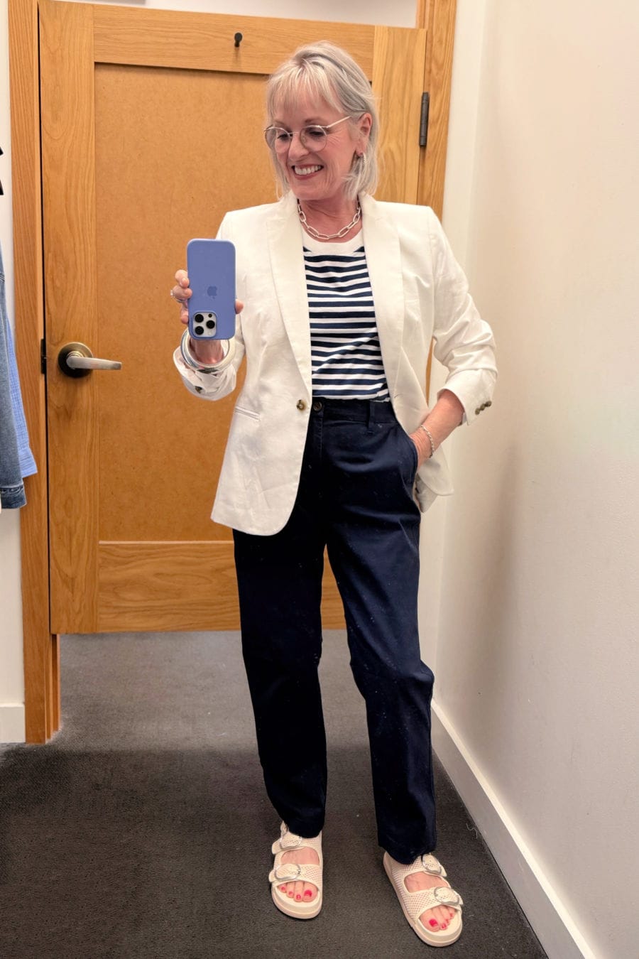 Chic summer outfit for mature lady with navy striped tee, white linen blazer, and navy chinos from J.Crew Factory