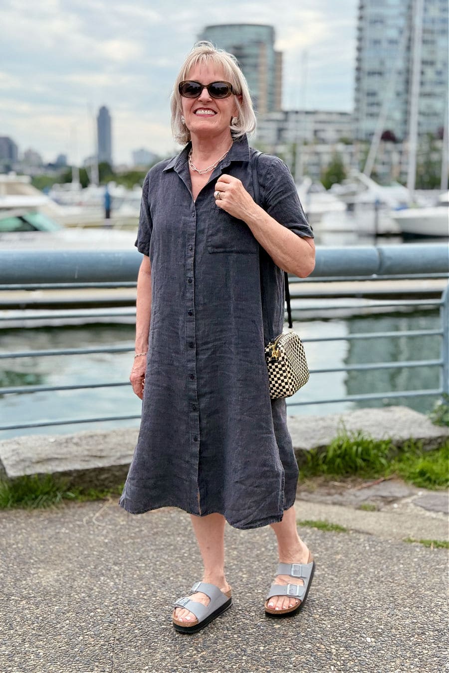 woman over 50 wearing gray dress with comfortable Papillio by Birkenstock Arizona Platform Sandals