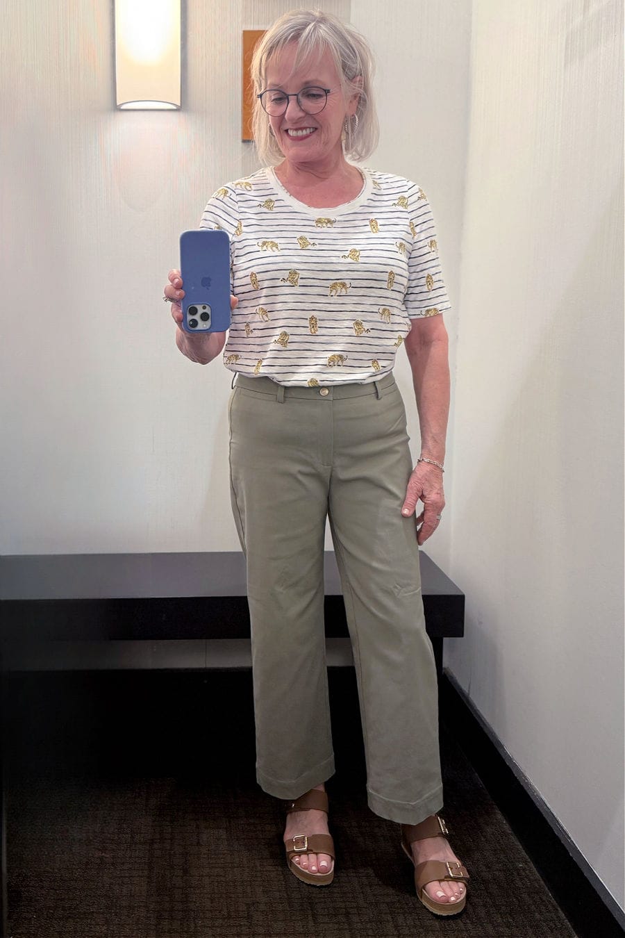 Woman over 50 wearing Chico’s leopard graphic tee and straight-leg trapunto pants for summer