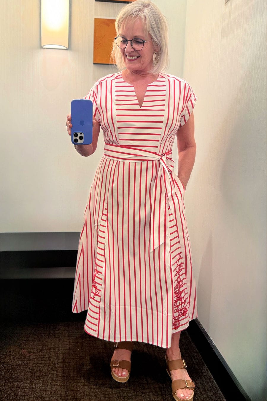 silver hiared woman wearing Embroidered striped godet maxi dress from Chico’s summer collection