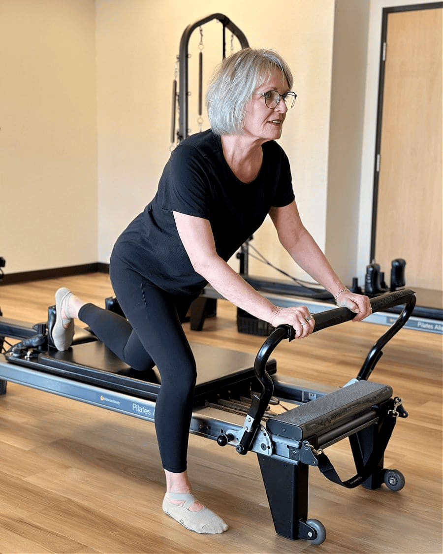 WOMAN DOING PILATES WORKOUT