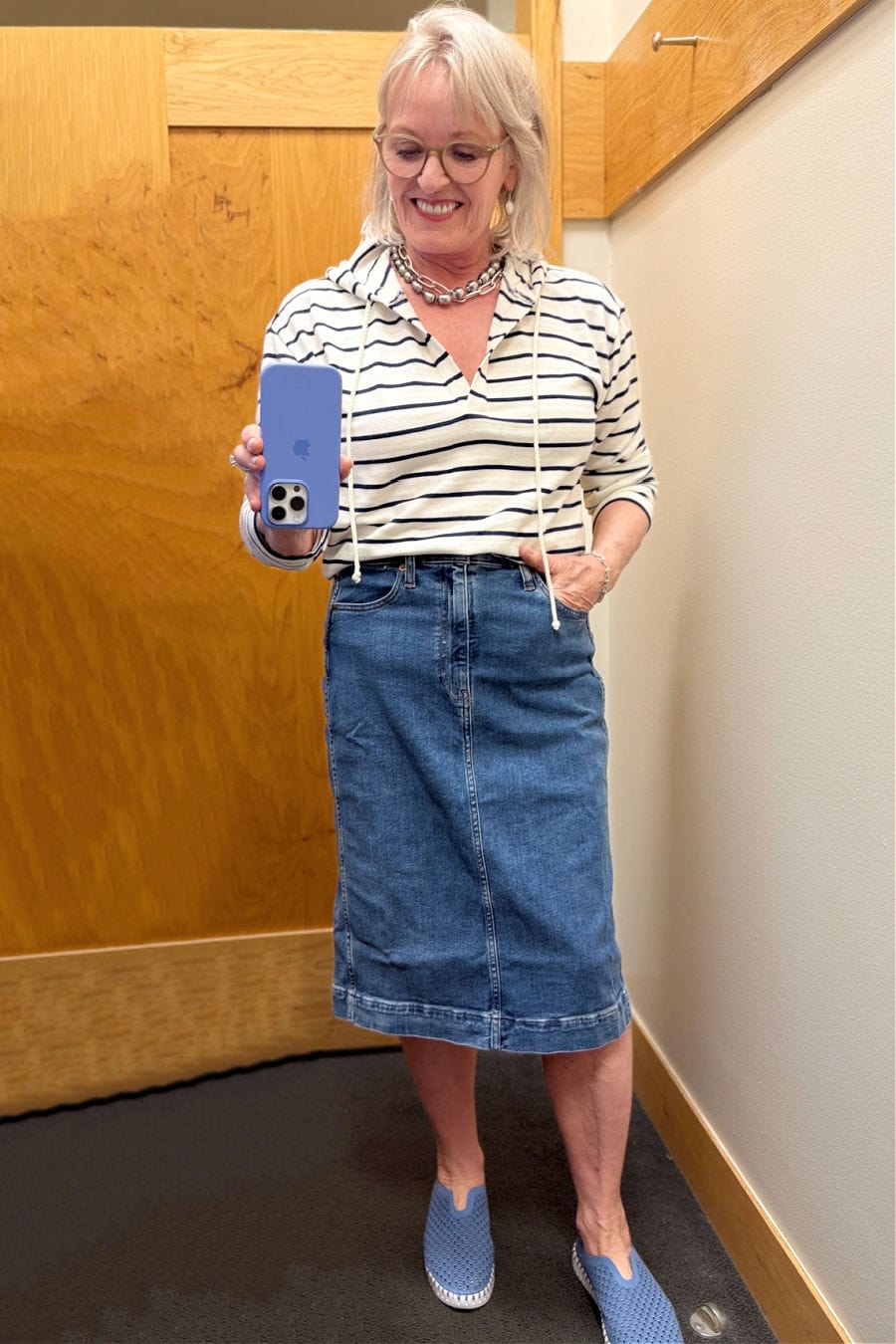 J.Crew Factory striped v-neck hoodie and knee-length denim midi skirt on mature woman, summer 2025 outfit idea