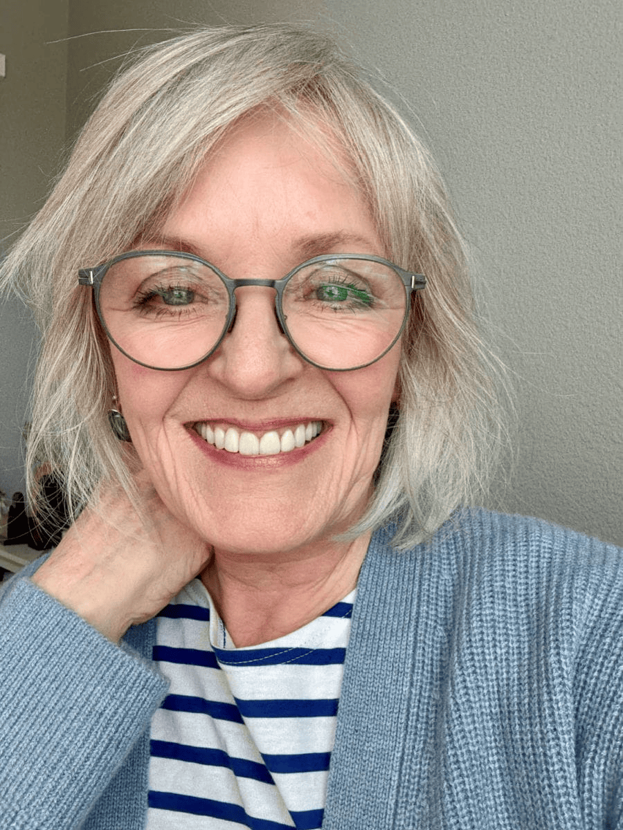OVER 60 MATURE WOMAN showing how to wear blush correctly.