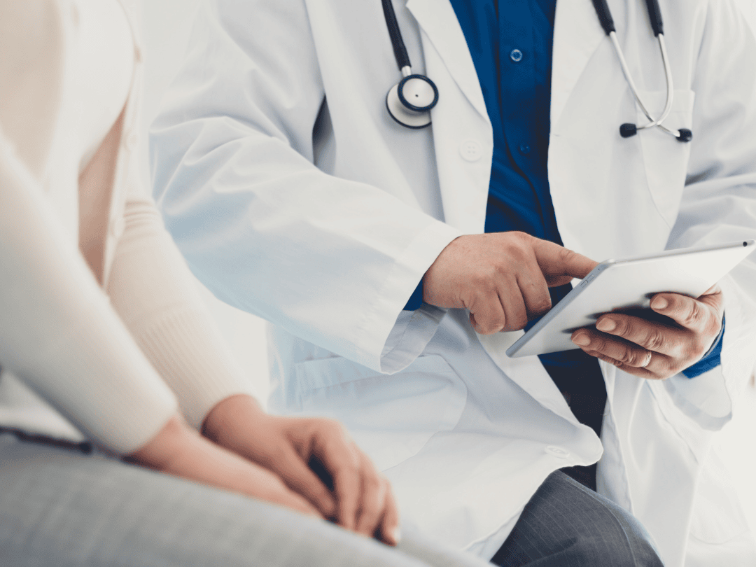 A DOCTOR AND PATIENT DISCUSSING HEALTH INFORMATION, WHAT TO DO IF YOU FEEL DISMISSED DURING A DOCTOR'S APPOINTMENT