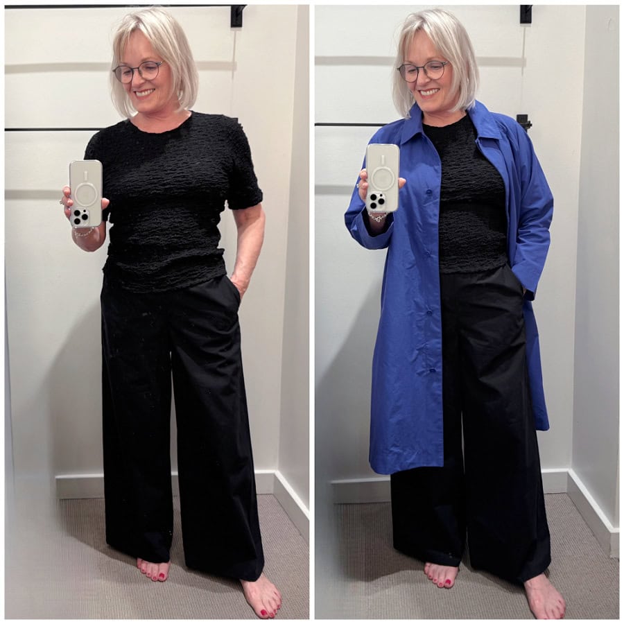 Jennifer wearing a bubble jacquard top with black poplin pants and a bright royal blue lightweight collar coat