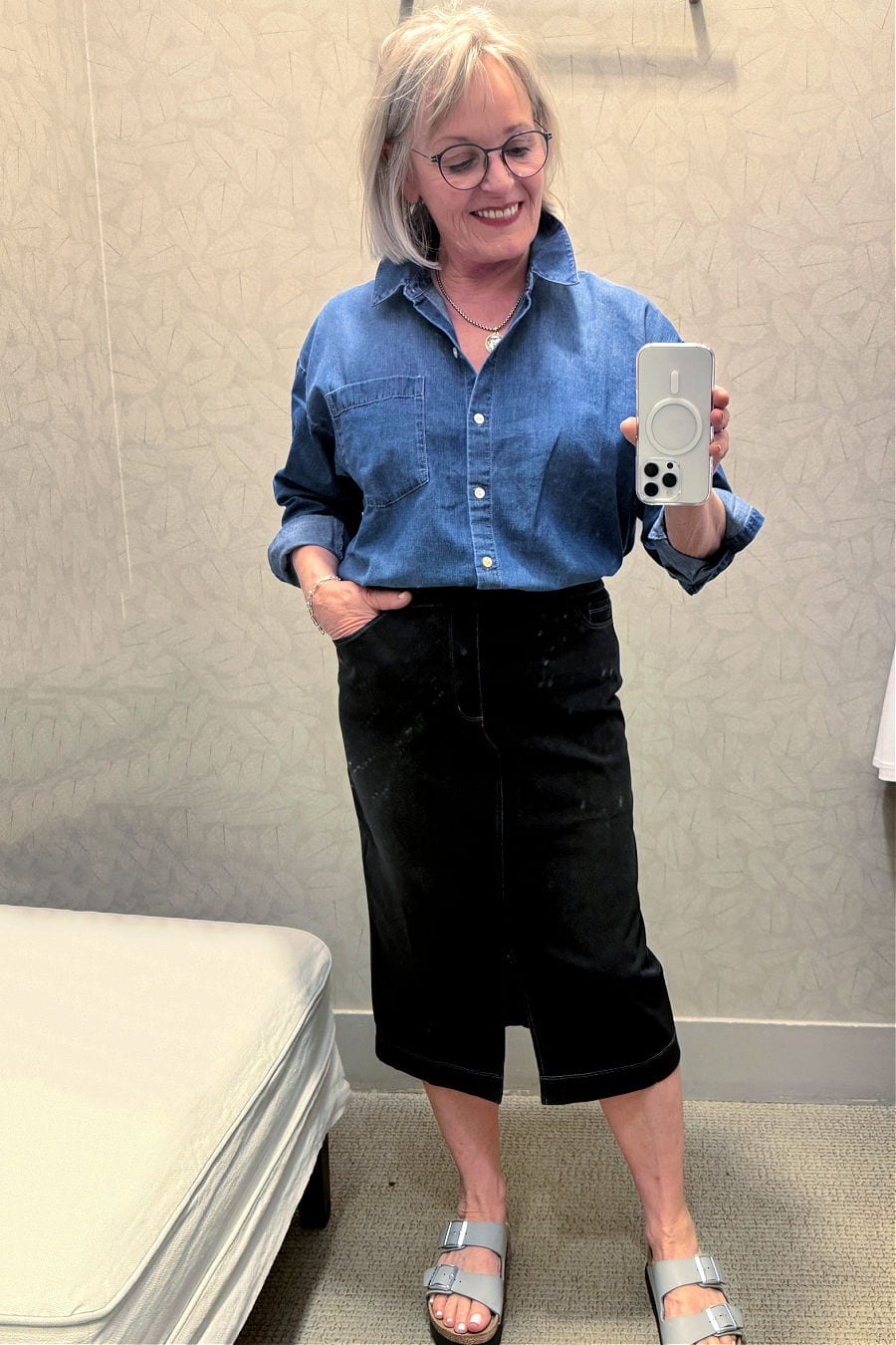 mature woman wearing j.jill denim shirt and denim midi skirt