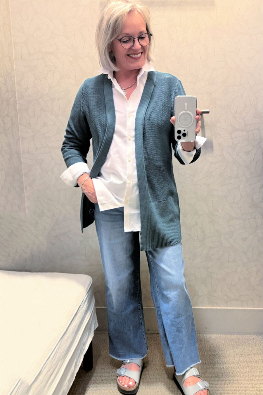 woman wearing green cardigan and wide leg jeans from j jill fall 2025 fall collection
