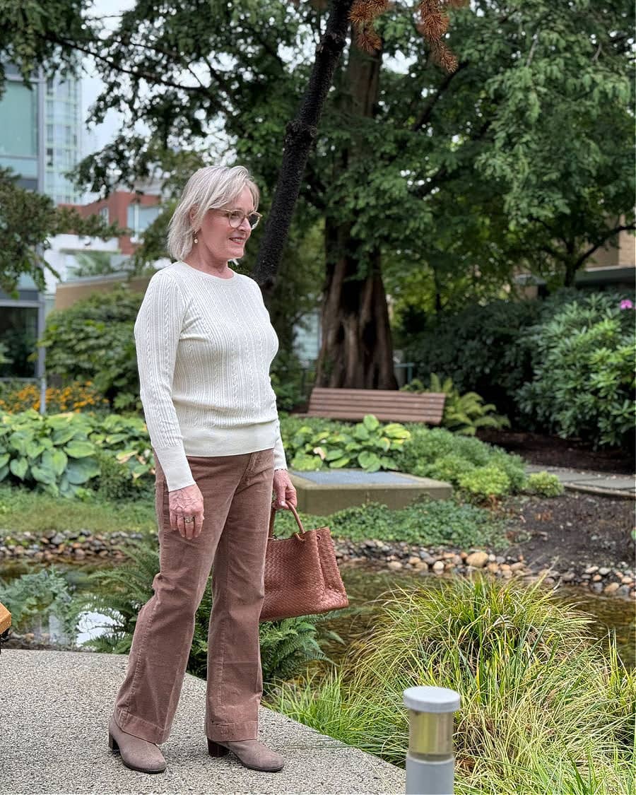 older woman wearing talbots cream sweater and tauped corduroy pants