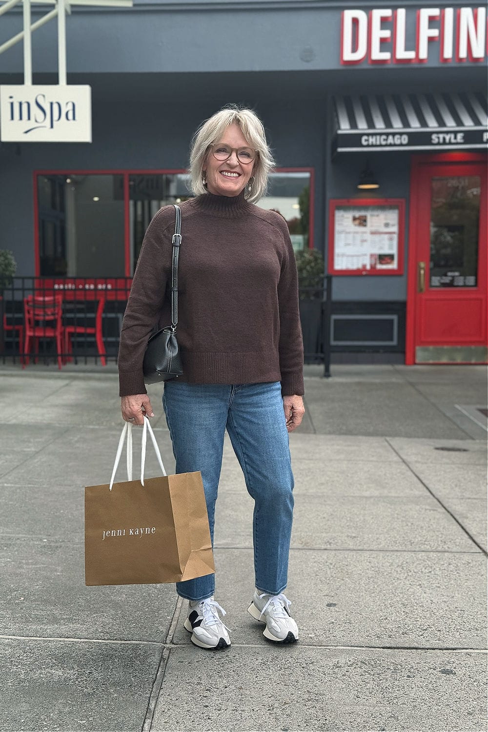 Older woman wearing new balance 327 sneakers for long day shopping