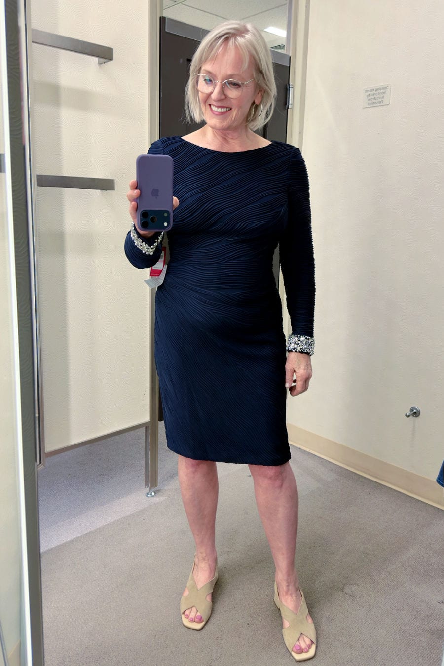 Rhinestone Detail Cocktail Dress
Navy pleated cocktail dress with bejeweled cuffs
