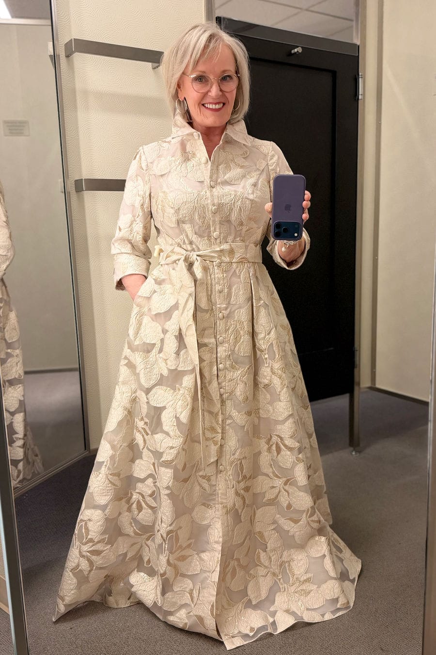 Alex Evenings Metallic Jacquard Gown Long metallic jacquard gown with dramatic collar and fabric bow belt worn by older woman for special occasion